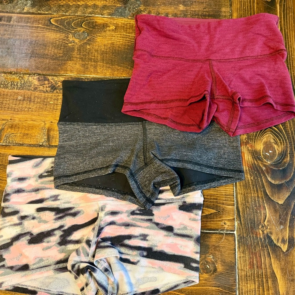 Lululemon (Set of 3) workout Shorts - Red, black/Gray, pink Camo - size 4